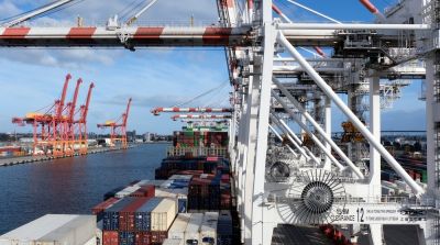 Melbourne, Australia 05 08 2025The container ship during cargo operation loading and discharging by gantry cranes operated by stevedores moored in port of Melbourne, Australia.